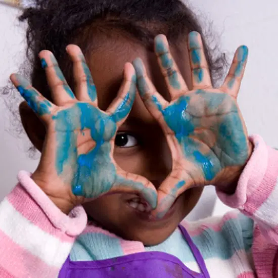 Our Curriculum - Preschool ages girl with painted hands
