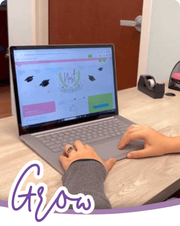 image of hands on a laptop screen and the laptop screen is open to a learning website called nest university with the word grow in purple script font below