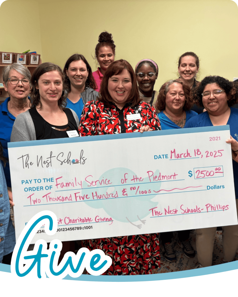 a group of people holding up an oversized charity check with the word give in blue script font below