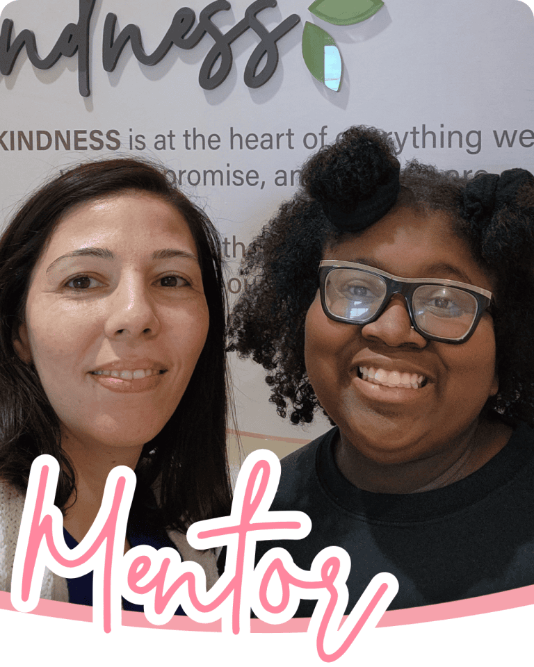 two women together taking a selfie with the word mentor in pink script below