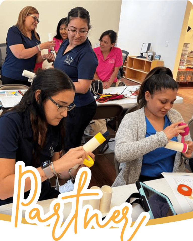 image of women during a professional development day working on different projects together at tables